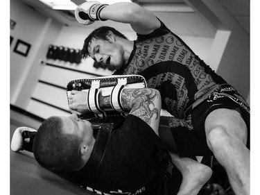 Stonehouse is put through his paces by Kru Jeff Harrison at the Ottawa Academy of Martial Arts.