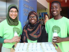 From left, Ghita El Janaty, 15, Fatouma Mohamed, 19, and David Bisimwa, 16, all part of a muesli-making social enterprise for youth started under the umbrella of the Parkdale Food Centre, were at the centre's Branching Out fundraising gala, held at the home of The GCTC on Thursday, June 23, 2016. (Caroline Phillips / Ottawa Citizen)