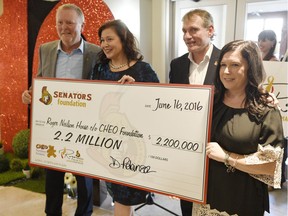 From left, Kevin Keohane, chief operating officer, CHEO Foundation, Danielle Robinson, president and chief executive, Ottawa Senators Foundation, Cyril Leeder, president, Ottawa Senators and Megan Wright, executive director, Roger Neilson House, pose with a cheque for $2.2M for the newly renamed Roger Neilson House on Thursday June 16, 2016.