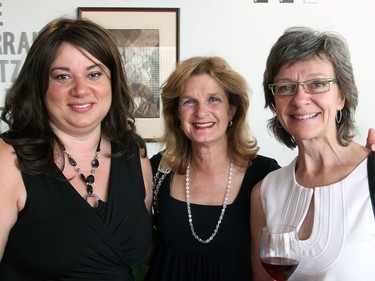 From left, Wellington West residents Gilda Ciamprone, Anna Stella Mangone and Becky Rynor, co-owner of Cube Gallery, were out to support the Parkdale Food Centre's Branching Out Gala, held at the home of the GCTC on Thursday, June 23, 2016. (Caroline Phillips / Ottawa Citizen)