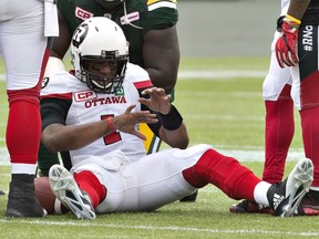 Ottawa Redblacks quarterback Henry Burris (1) looks at his injured hand during second half CFL action in Edmonton on Saturday, June 25, 2016. Burris had to leave the game, and Trevor Harris came in to lead Ottawa to victory.
