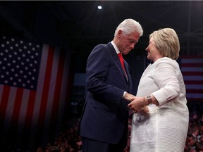 Democratic presidential candidate Hillary Clinton and her husband, former U.S. president Bill Clinton, embrace during primary night, June 7, in Brooklyn, New York.