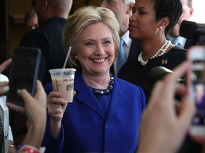 Here's to you: Democratic presidential candidate Hillary Clinton poses for photos in Washington June 10.