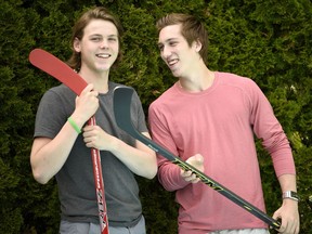 Hockey brothers Samuel, left, and William Bitten, right, are photographed in their backyard in Ottawa Wednesday June 15, 2016. William is about to be drafted into the NHL, after a rough season playing in Flint, MI while his brother, Samuel, was just drafted by the Ottawa 67s.