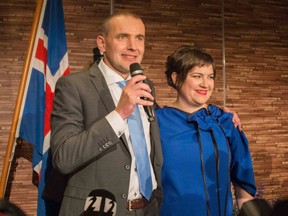 Gudni Johannesson, with wife Eliza Reid at his side, speaks at an election party in Reykjavik, on June 25, 2016.