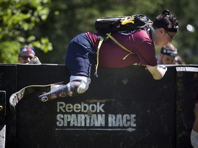 Jeffrey Beausoleil ran the Spartan Sprint Race at Edelweiss Valley Saturday June 18, 2016. Beausoleil is raising money for the Shriners Hospitals for Children by taking part in multiple races this summer. Beausoleil was born without a hand and a foot.