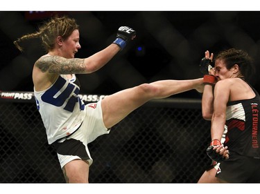 Joanne Calderwood, left, lands a high kick on Valerie Letourneau.