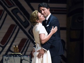 Prime Minister Justin Trudeau and his wife Sophie Gregoire Trudeau joke on stage during the annual Press Gallery Dinner at the Museum of Nature on Saturday, June 4, 2016 in Gatineau, Quebec.
