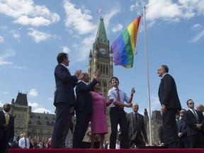 Prime Minister Justin Trudeau takes part in a pride flag raising ceremony on Parliament Hill, Wednesday, June 1, 2016 in Ottawa.