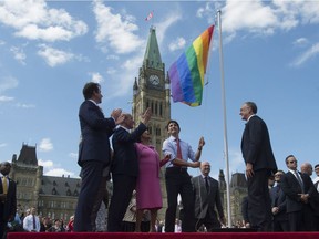Prime Minister Justin Trudeau takes part in a pride flag raising ceremony on Parliament Hill on June 1.