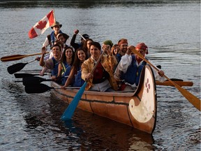 Prime Minister Justin Trudeau paddles in a voyageur canoe on the Ottawa River following the National Aboriginal Day Sunrise Ceremony in Gatineau.