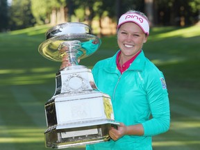 Brooke Henderson poses with the trophy after winning the KPMG Women's PGA Championship at the Sahalee Country Club on June 12, 2016 in Sammamish, Wash.