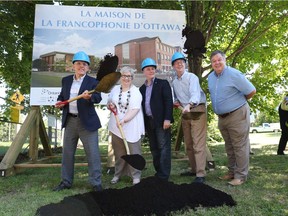 Then-Ontario energy minister Bob Chiarelli, MPP for Ottawa-West-Nepean, Andrée Duchesne, board chair of the Coopérative multiservices francophone de l'Ouest d'Ottawa, Bay Ward Coun. Mark Taylor, Mayor Jim Watson and Alta Vista Coun. Jean Cloutier participate in the ground breaking ceremony to launch the renovations of the old Grant school at 2720 Richmond Road on June 26, 2015.