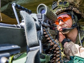 Private Nichola Goulet, a member of 1st Battalion, The Royal Canadian Regiment, looks through a C9 machine gun during Exercise MAPLE RESOLVE at Wainwright, Alberta on June 2, 2016.

Photo: Master Corporal Precious Carandang, 4th Canadian Division Public Affairs
LX01-2016-0033-051