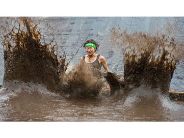 Marie-France Marcoux makes a splash down in a mud pit as the Mud Hero Ottawa 2016 continued on Sunday at Commando Paintball located east of Ottawa.