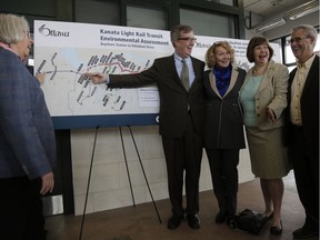 Mayor Jim Watson was joined by a group of city councillors and Liberal MPs Karen McCrimmon and Anita Vandenbeld at the Terry Fox transit station to announce the beginning of an environmental assessment as a first step to expanding the LRT into Kanata.