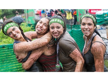 Melodie Thibert, (from left) Vanessa Chabot, Emilie Chabot, and Marie-Claude Thibert at the finish line as the Mud Hero Ottawa 2016 continued on Sunday at Commando Paintball located east of Ottawa.