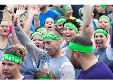 Mike Smith (C) leads the group in a cheer as they get ready to begin as the Mud Hero Ottawa 2016 continued on Sunday at Commando Paintball located east of Ottawa.