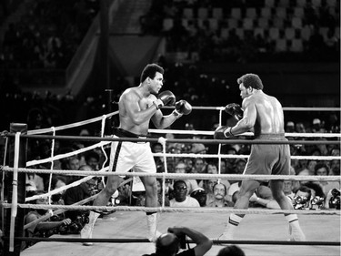 Former world heavyweight champion Muhammad Ali (L) and titleholder US George Foreman (R) fight on October 30, 1974 in Kinshasa, Zaire during their world heavyweight championship match. Ali won by knocking out Foreman in the eighth round.