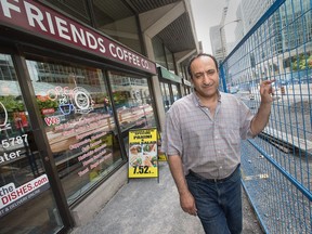 Nasser Abou-El-Daoule outside his restaurant Friends Coffee Co as area merchants along the entire length of Queen St complain about the extreme loss of business due to construction for the LRT.