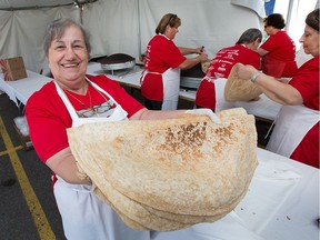 Nawal Ayoub shows off some freshly made Saj bread at the Ottawa Lebanese Festival.