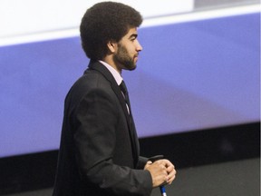 Neil Doef walks onto the stage to be presented with EJ McGuire Award before the start of the second day of the NHL draft at the First Niagara Center in Buffalo on Saturday, June 25, 2016.