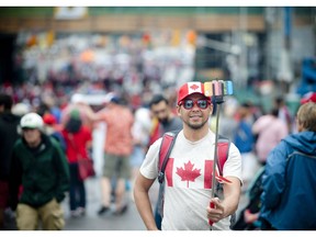 New Canadian citizen Kiet To takes a selfie during the Canada Day festivities in Ottawa on July 1, 2015. Is there anywhere else you'd rather live?