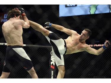 Olivier Aubin-Mericer, left, fights Thibault Gouti in a lightweight bout during UFC Fight Night: MacDonald vs. Thompson at TD Place Arena Saturday June 18, 2016. (Darren Brown. Aubin-Mercier won in the third round by submission via rear naked choke.