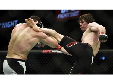 Olivier Aubin-Mericer, right, fights Thibault Gouti in a lightweight bout during UFC Fight Night: MacDonald vs. Thompson at TD Place Arena Saturday June 18, 2016. (Darren Brown. Aubin-Mercier won in the third round by submission via rear naked choke.