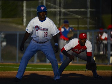 Ottawa Champions player Donal Duarte takes a lead in front of Cuban national team player Yasiel Santoya.