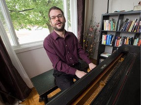Ottawa jazz pianist Steve Boudreau in his home at his piano playing a George Gershwin tune as he prepares for an upcoming performance.