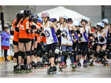 Ottawa Junior Roller Derby, left, gets ready to compete against Montreal's Rhythm and Bruise during a junior roller derby bout at Brewer Arena.