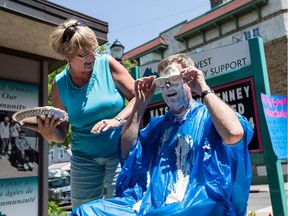 Ottawa Mayor Jim Watson gets a pie in the face from Leah Doiron who entered a draw in support of the Ottawa West Community Support community health centre. Friday June 24, 2016. Errol McGihon