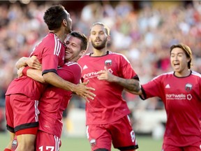 Ottawa's Carl Haworth hoists Paulo Junior in the air after he scored late in the first half to make it 2-0 for Ottawa. Ottawa Fury FC matchup against the Vancouver Whitecaps FC Wednesday (June 1, 2016) at TD Place in Ottawa.