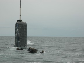 Canadian Army Pathfinders launch off the submerging HMCS Windsor in 2006. Other Pathfinders parachuted into the ocean to link up with HMCS Windsor. Photo by David Pugliese