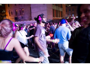 People danced the night away to the sound of battling DJ'S pumping tunes through headphones at the silent disco at Glowfair Festival Friday June 17, 2016.