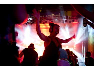 People danced the night away to the sound of battling DJ'S pumping tunes through headphones at the silent disco at Glowfair Festival Friday June 17, 2016.