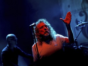 In this Thursday March 21, 2013 photo, Robert Plant, lead vocalist and lyricist of the rock band Led Zeppelin, performs in Singapore.