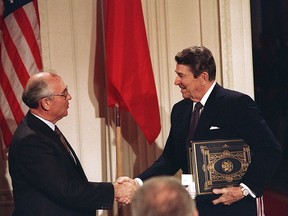 In this Dec. 8, 1987 file photo, U.S. President Ronald Reagan, right, shakes hands with Soviet leader Mikhail Gorbachev at the White House after the two leaders signed the Intermediate Range Nuclear Forces Treaty to eliminate intermediate-range missiles.
