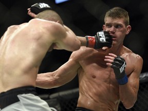 Rory MacDonald, left, fights Stephen Thompson in the welterweight main event during UFC Fight Night: MacDonald vs. Thompson at TD Place Arena Sunday June 19, 2016. (Darren Brown. Thompson won with a unanimous decision.