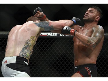 Sean O'Connell, left, battles Steve Bosse in a light heavyweight bout during UFC Fight Night: MacDonald vs. Thompson at TD Place Arena Sunday June 19, 2016.