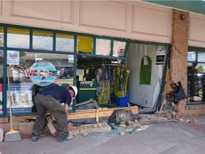 Storefront of Hillary's Cleaners in Stittsville shortly after the navy blue SUV that crashed into it was pulled away, Tuesday, June 28, 2016.