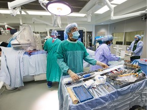 Surgery during a minimally invasive surgical procedure in the new, high tech operating room at the Ottawa Hospital.