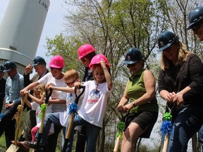 The family of Manon Brousseau along with dignitaries officially turn the sod for a new Habitat for Humanity home.