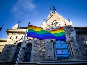 The pride flag flew over a large group that gathered at the Human Rights monument on Elgin Street Sunday June 12, 2016 to show support for the mass shooting in Orlando at Pulse, a gay nightclub. The Flag stands just outside City Hall.   Ashley Fraser