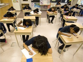 TORONTO, ONTARIO: JANUARY 19, 2012 - Grade 8 girls take a math test in an all girls classroom at Humberwood Downs Junior Middle Academy at Humberwood Centre in Toronto, Ontario, Thursday, January 19, 2012.    (Tyler Anderson/National Post)  (For Toronto story by Peter Kuitenbrouwer) //NATIONAL POST STAFF PHOTO // 1212 na boards ORG XMIT: POS2013052717310577

0116 na genocide