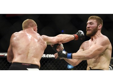 Toronto's Misha Cirkunov, left, narrowly misses Ion Cutelaba.