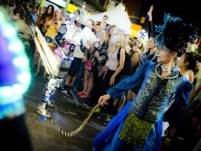 A neon street performance dazzeld spectators at Glowfest in 2014. The free party on Bank Street is back this weekend, just one of eight festivals rumming across Ottawa in the next few days.
