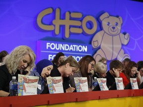 Volunteers answer phones at the CHEO Telethon at the EY Centre on Sunday, June 5, 2016.