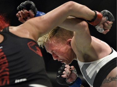 Windsor's Randa Markos, left, battles Jocelyn Jones-Lybarger in a prelim women's strawweight bout.